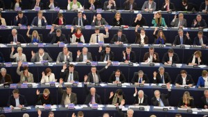 epaselect epa04657510 A general view shows members of the European Parliament voting during the plenary session in the European Parliament in Strasbourg, France, 11 March 2015. The House will vote on separate resolutions on the murder of Russian Boris Nemtsov and the state of democracy in Russia, the annual foreign policy report, the annual report on human rights in the world, and on the cooperation with the League of Arab States. EPA/PATRICK SEEGER